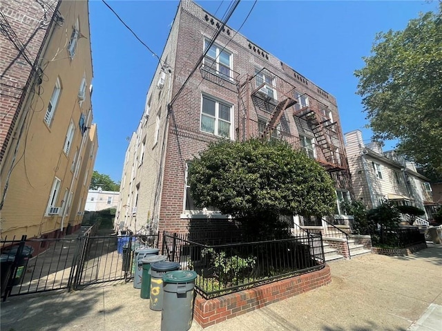 view of building exterior with fence