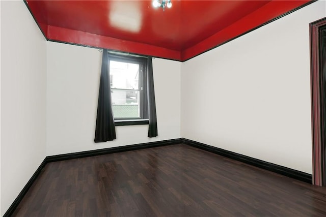 unfurnished room featuring hardwood / wood-style flooring