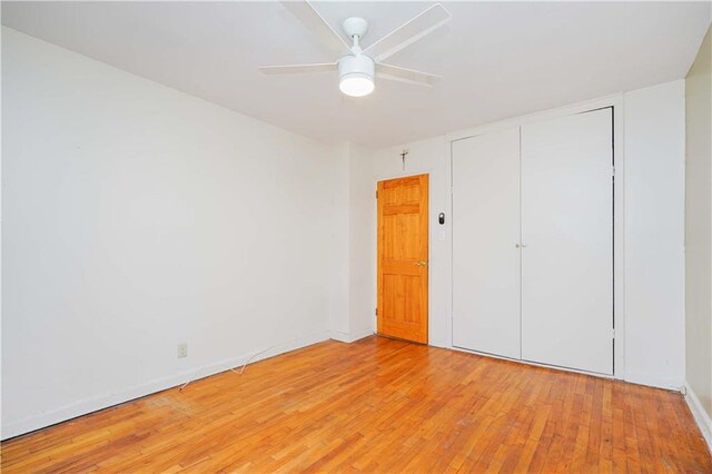 unfurnished bedroom featuring a closet, ceiling fan, and light hardwood / wood-style floors