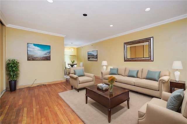 living room featuring light wood-type flooring and crown molding