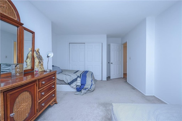 carpeted bedroom with a closet