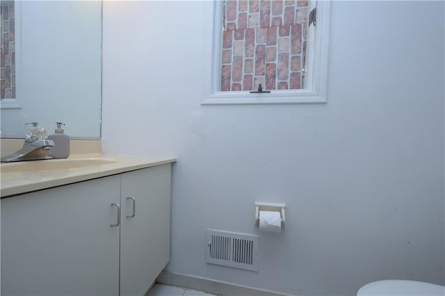 bathroom with tile patterned floors and vanity