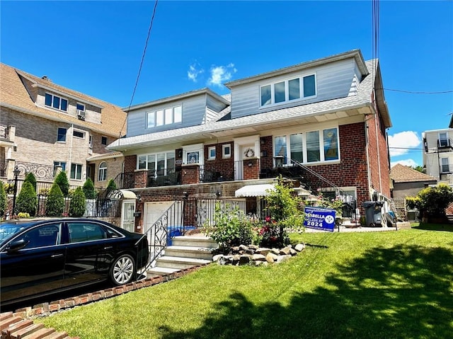 view of front of property featuring a garage and a front yard