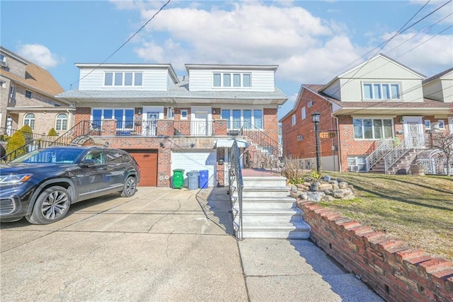 view of front of house with a garage and a front yard