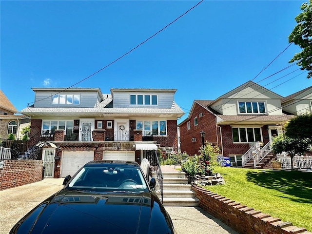 view of front of house featuring a garage and a front lawn