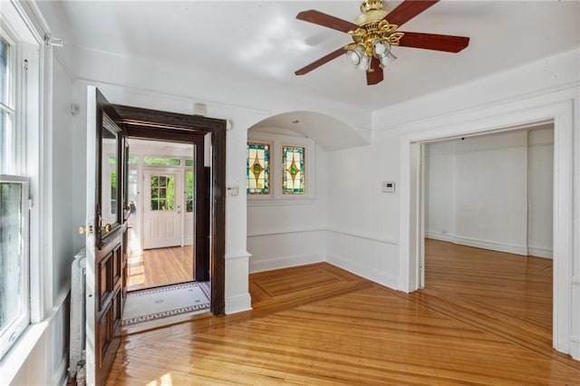 foyer featuring ceiling fan and light wood-type flooring
