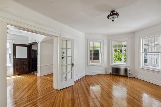 unfurnished sunroom with radiator