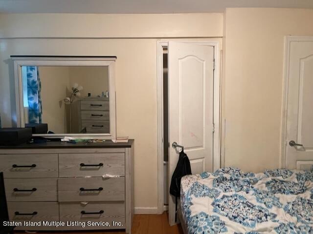 bedroom featuring wood-type flooring