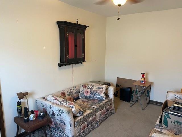 living room featuring light colored carpet and ceiling fan