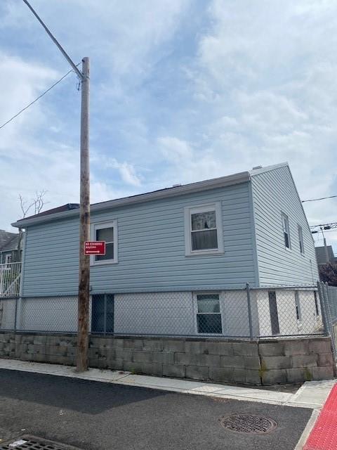 view of property exterior with fence