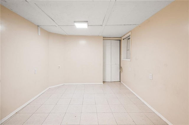 unfurnished room featuring baseboards