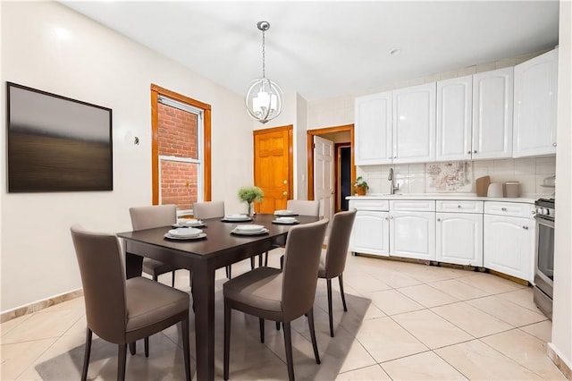 dining area featuring baseboards and light tile patterned floors