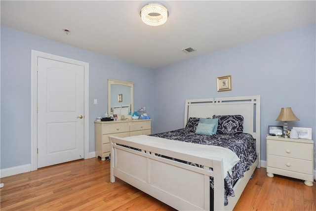 bedroom with light wood-type flooring