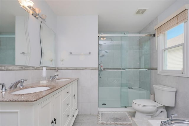 40 Di Marco Pl, Staten Island, NY 10306 - full bath with tile walls, visible vents, tile patterned flooring, and a sink