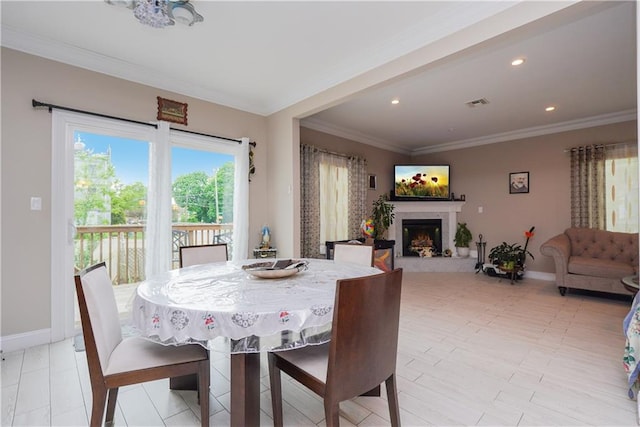 dining space with ornamental molding