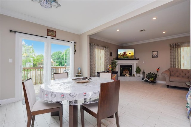 40 Di Marco Pl, Staten Island, NY 10306 - dining area featuring recessed lighting, ornamental molding, baseboards, visible vents, and a lit fireplace