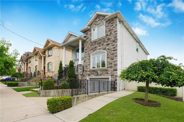 view of front of house with a garage and a front lawn