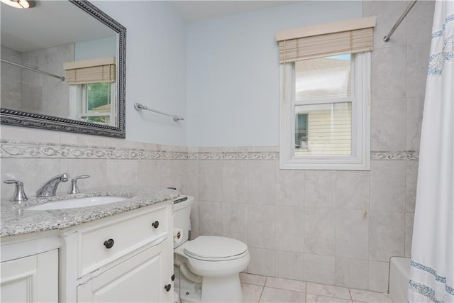 full bathroom with toilet, tile walls, vanity, shower / bath combination with curtain, and tile patterned flooring