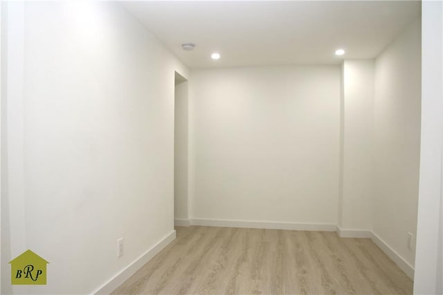 unfurnished room with light wood-type flooring