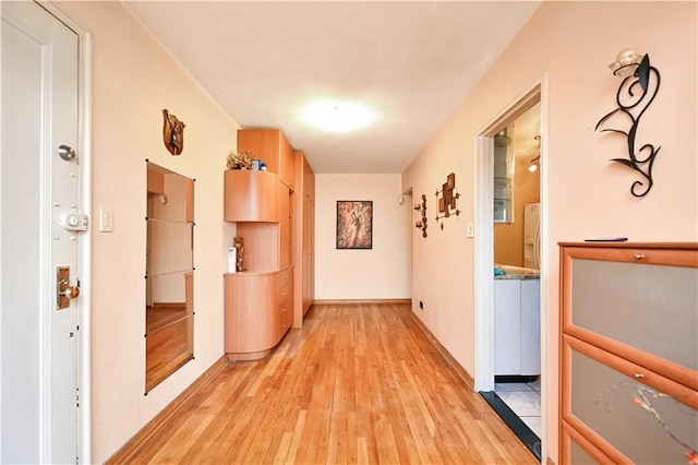 corridor featuring light hardwood / wood-style flooring