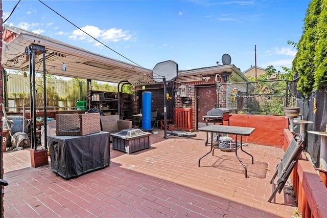 exterior space featuring a fire pit and grilling area