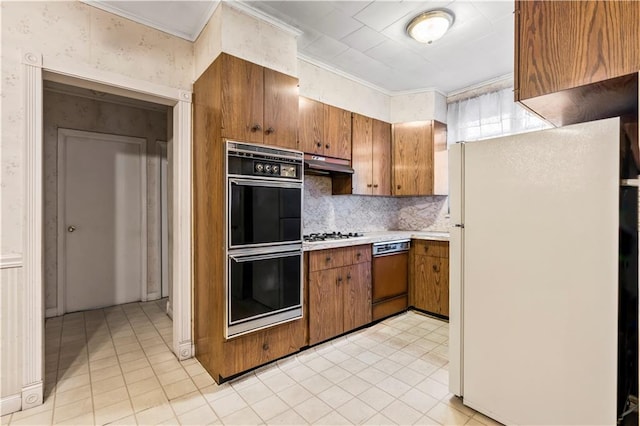 kitchen with crown molding, backsplash, and white appliances