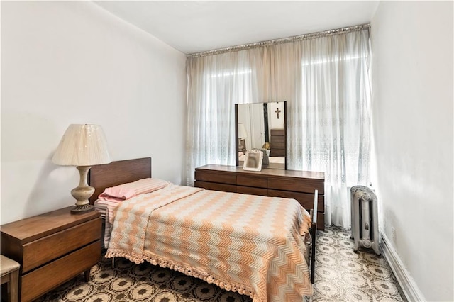 bedroom featuring radiator