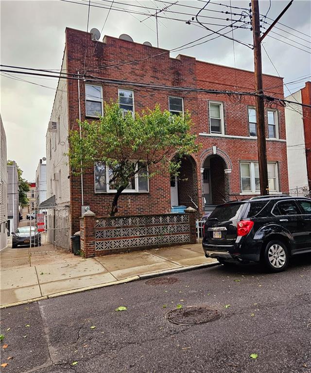 view of property with brick siding