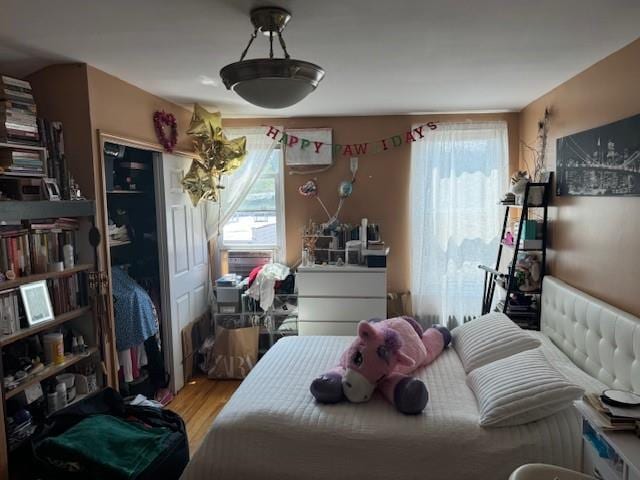 bedroom with wood finished floors