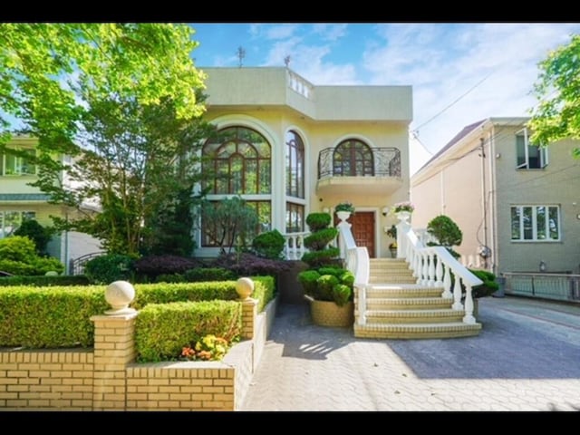 view of front of property with a balcony