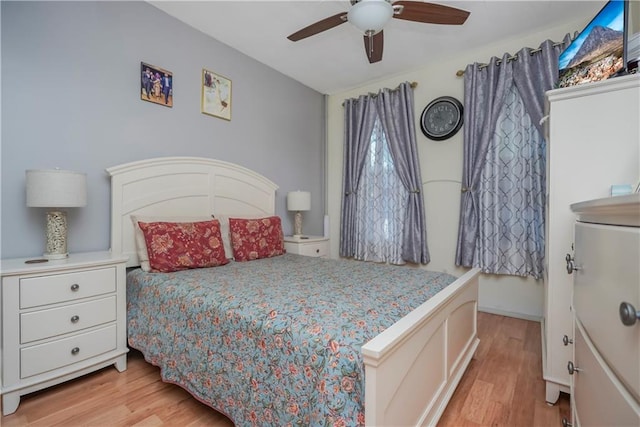 bedroom featuring ceiling fan and light hardwood / wood-style flooring