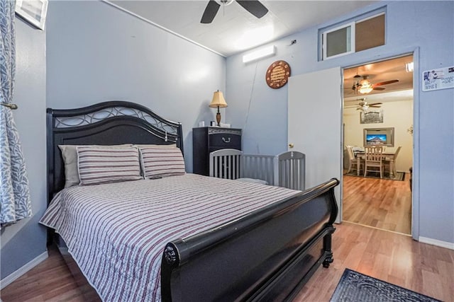 bedroom featuring hardwood / wood-style floors and ceiling fan