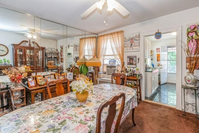 carpeted dining room with cooling unit and ceiling fan