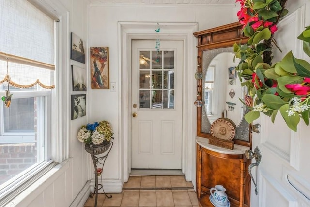 entryway featuring a healthy amount of sunlight and light tile patterned flooring