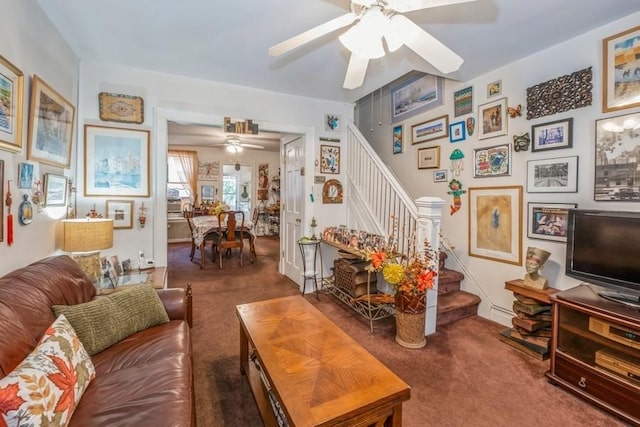 living room featuring ceiling fan and dark colored carpet