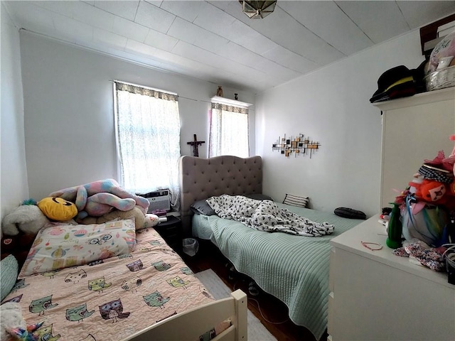 bedroom featuring a wall mounted air conditioner