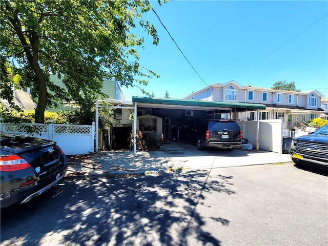 view of front of home with a carport