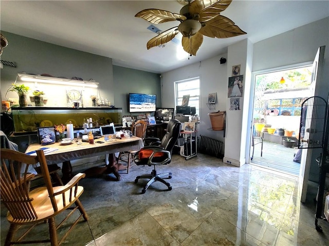 home office featuring radiator, plenty of natural light, and ceiling fan