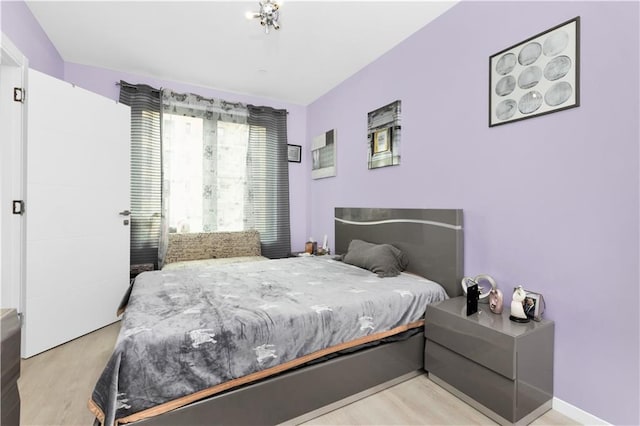 bedroom with light hardwood / wood-style floors