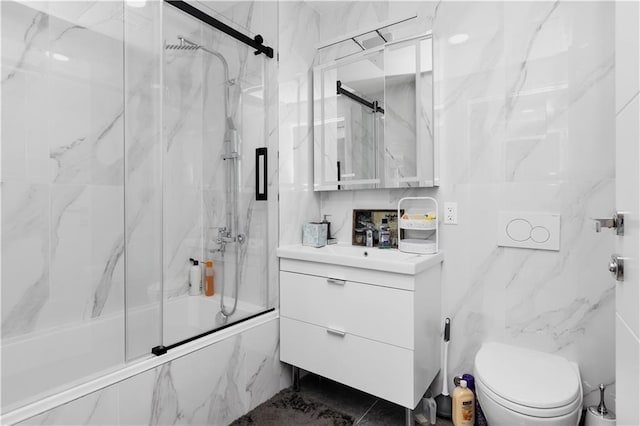 full bathroom with vanity, toilet, and enclosed tub / shower combo