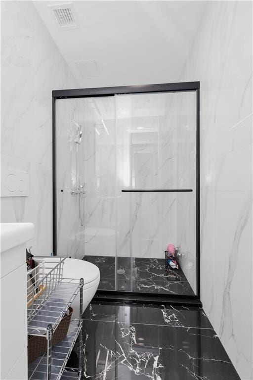 bathroom with toilet and an enclosed shower