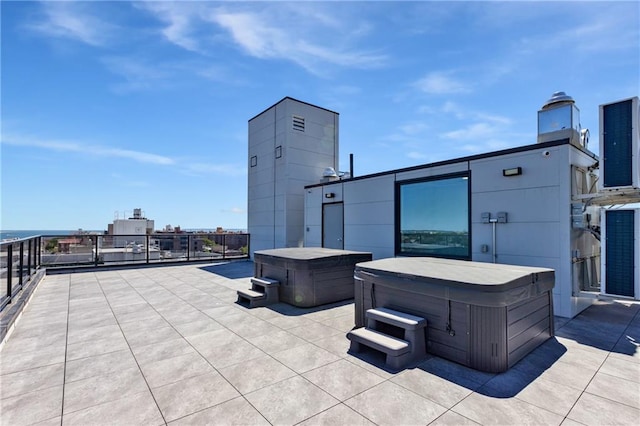 view of patio with a hot tub