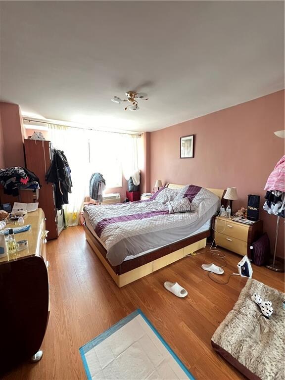 bedroom with hardwood / wood-style floors