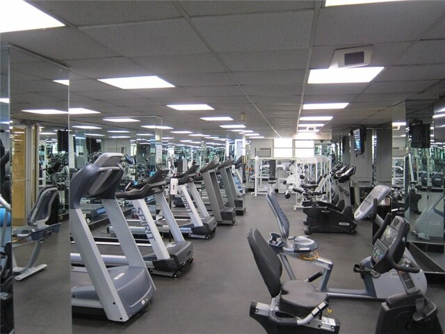 gym featuring a paneled ceiling