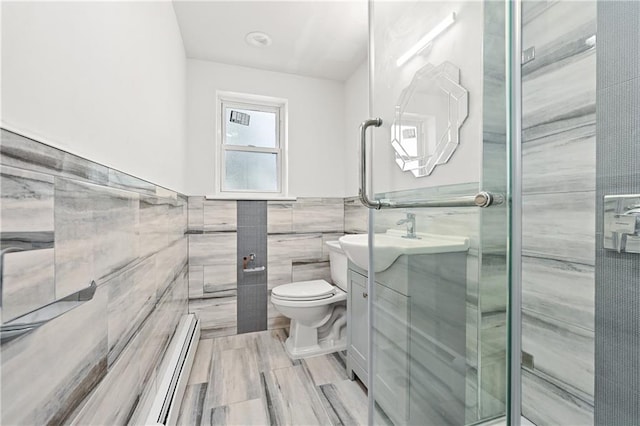 1021 E 87th St Unit 6B, Kings, NY 11236 - full bath featuring tile walls, toilet, a baseboard radiator, vanity, and a shower stall