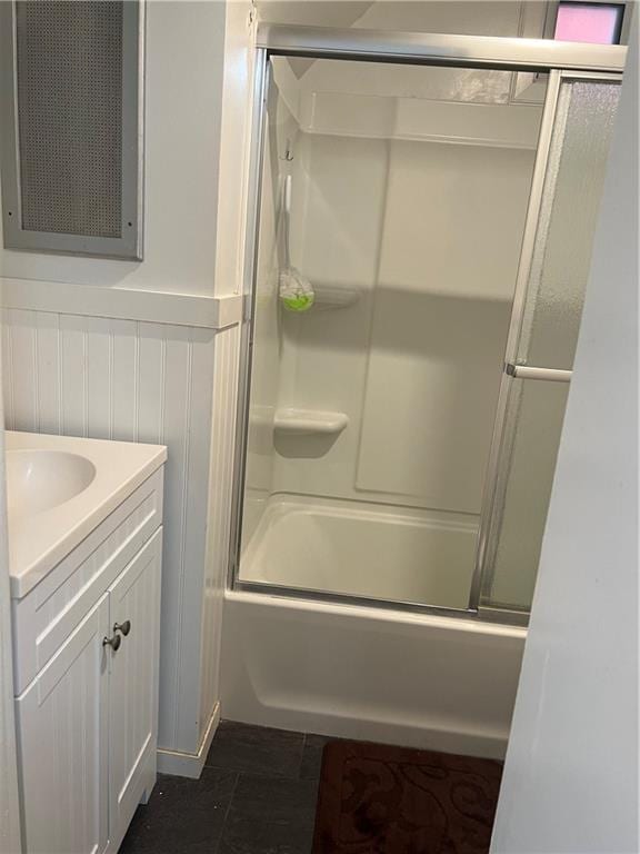 bathroom with shower / bath combination with glass door and vanity