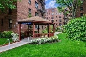 view of community featuring a lawn and a gazebo