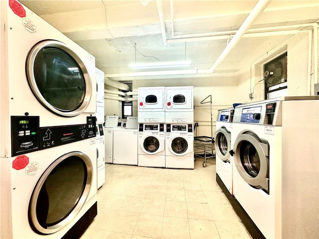 shared laundry area with stacked washer / dryer and independent washer and dryer