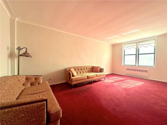 living room with crown molding and carpet flooring