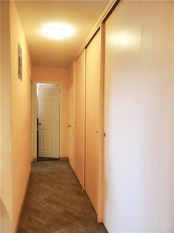 hallway featuring baseboards